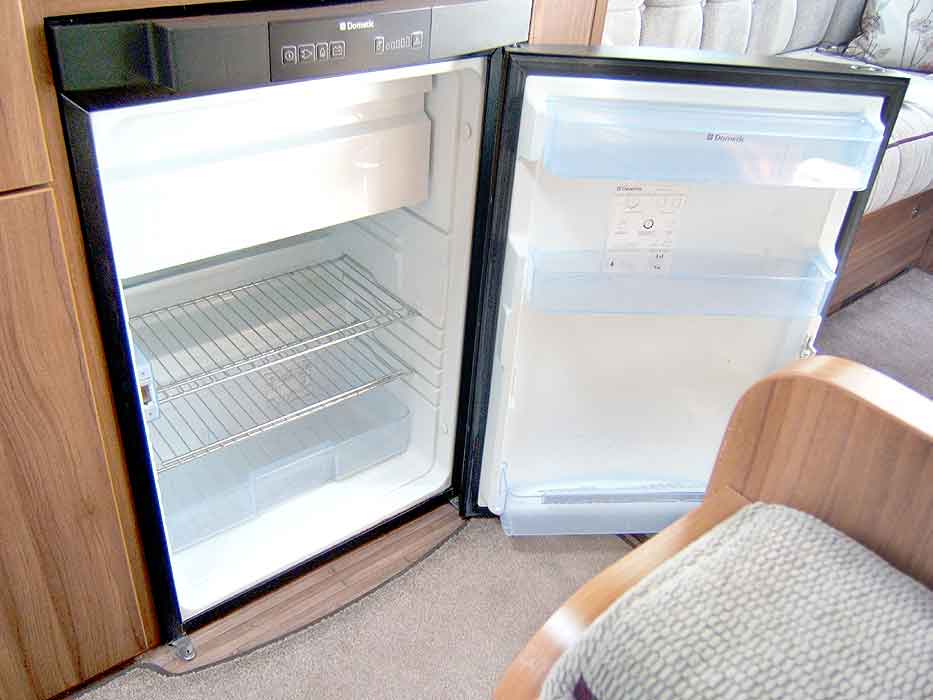 Interior view of the fridge with freezer top box.